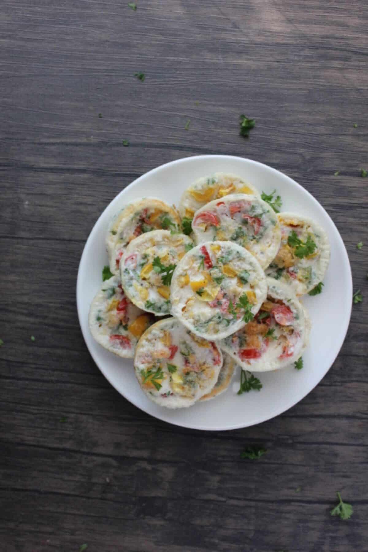 Image of egg white bites on plate from overhead shot.